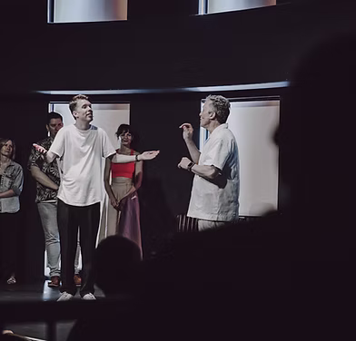 Audience laughing during improv scene